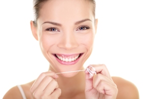 bigstock-Dental-flush--woman-flossing--49152716